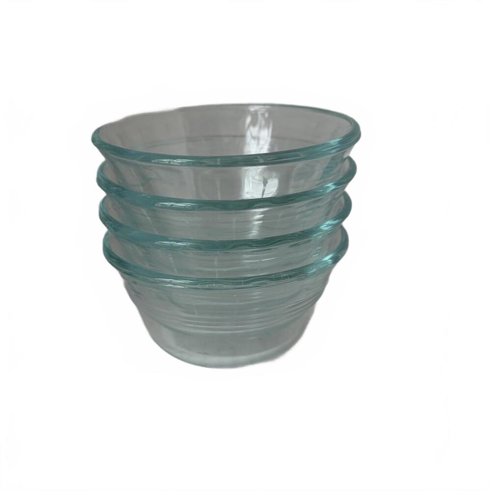 A set of four vintage Pyrex ribbed glass custard cups or prep bowls.